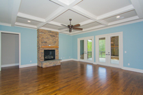 Circle H Builders Columbi SC living room with fireplace and coffered ceilings.